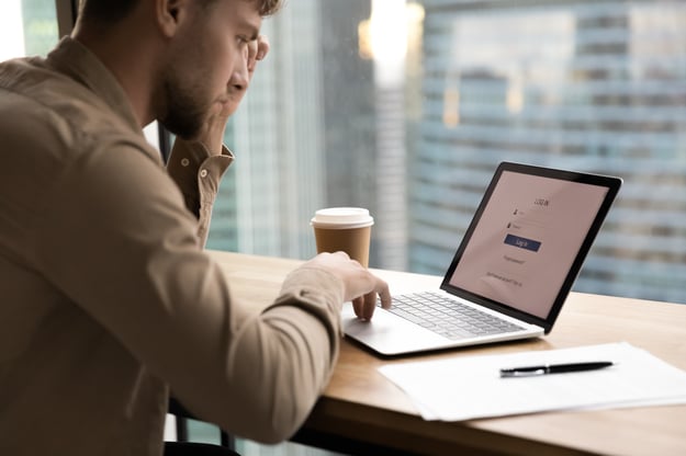 man looking at the login screen